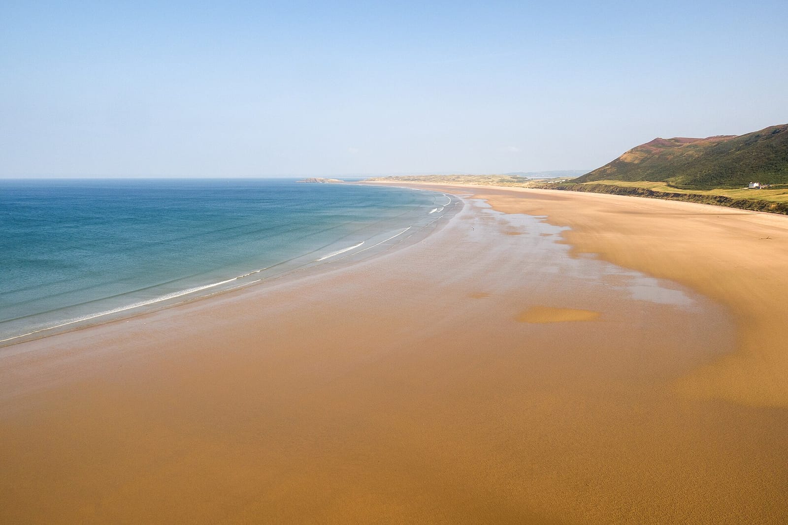 The wide sweep of sand at Rhossili Bay on the Gower Peninsula