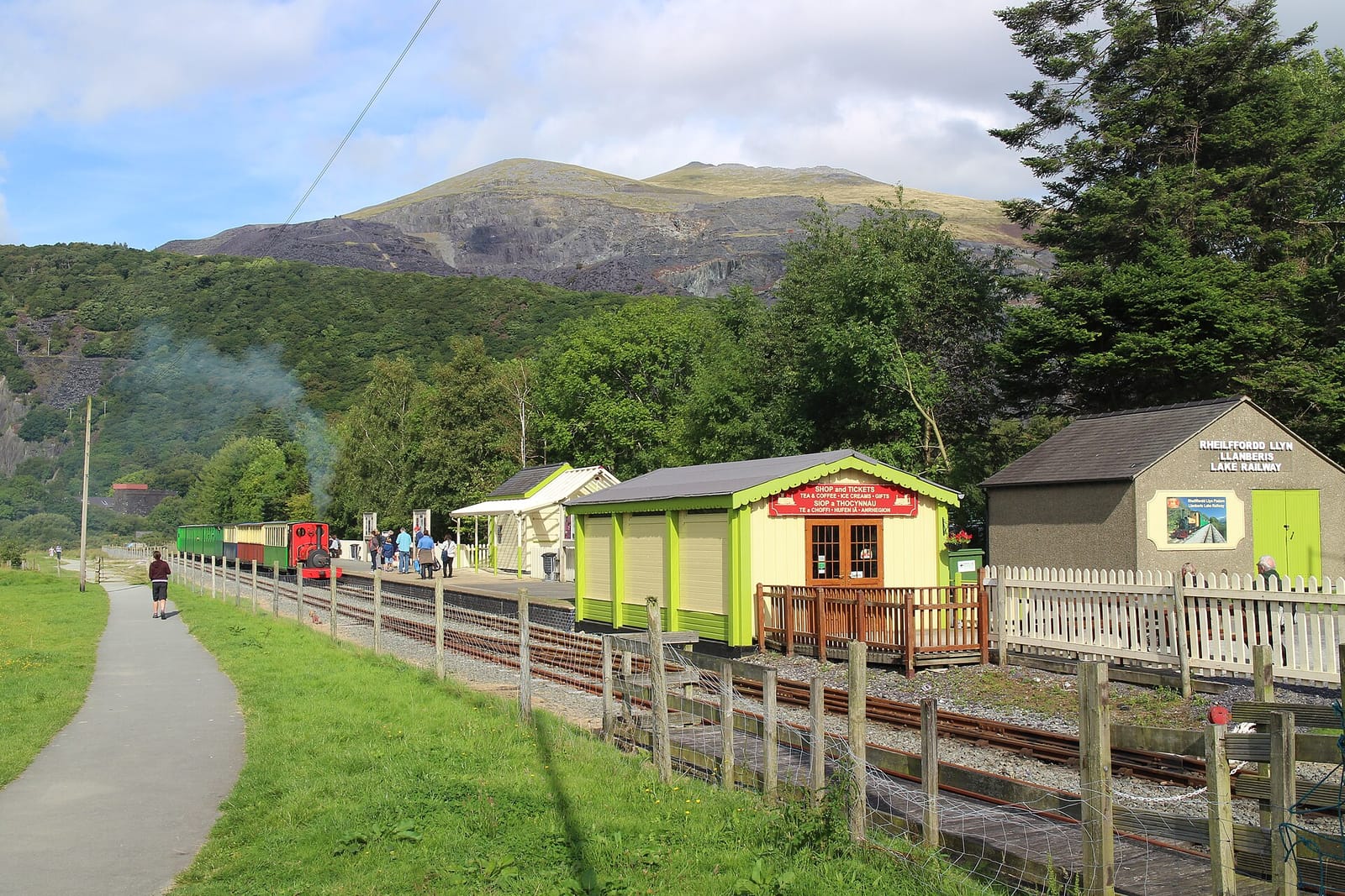 The Llanberis Lake Railway running along Llyn Padarn below the Snowdonia mountains