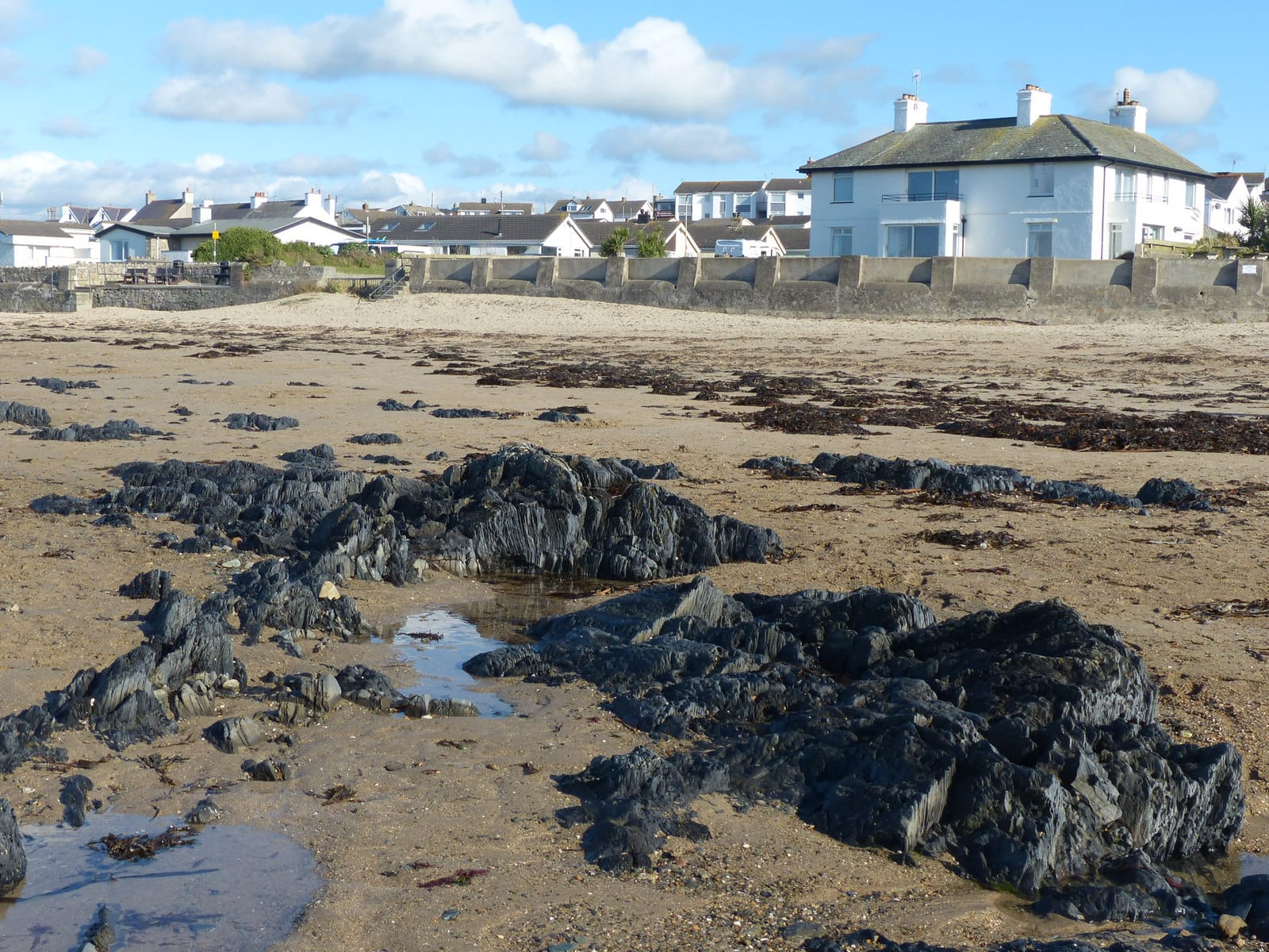 The rocky, dune-backed beach at Rhosneigr on Anglesey